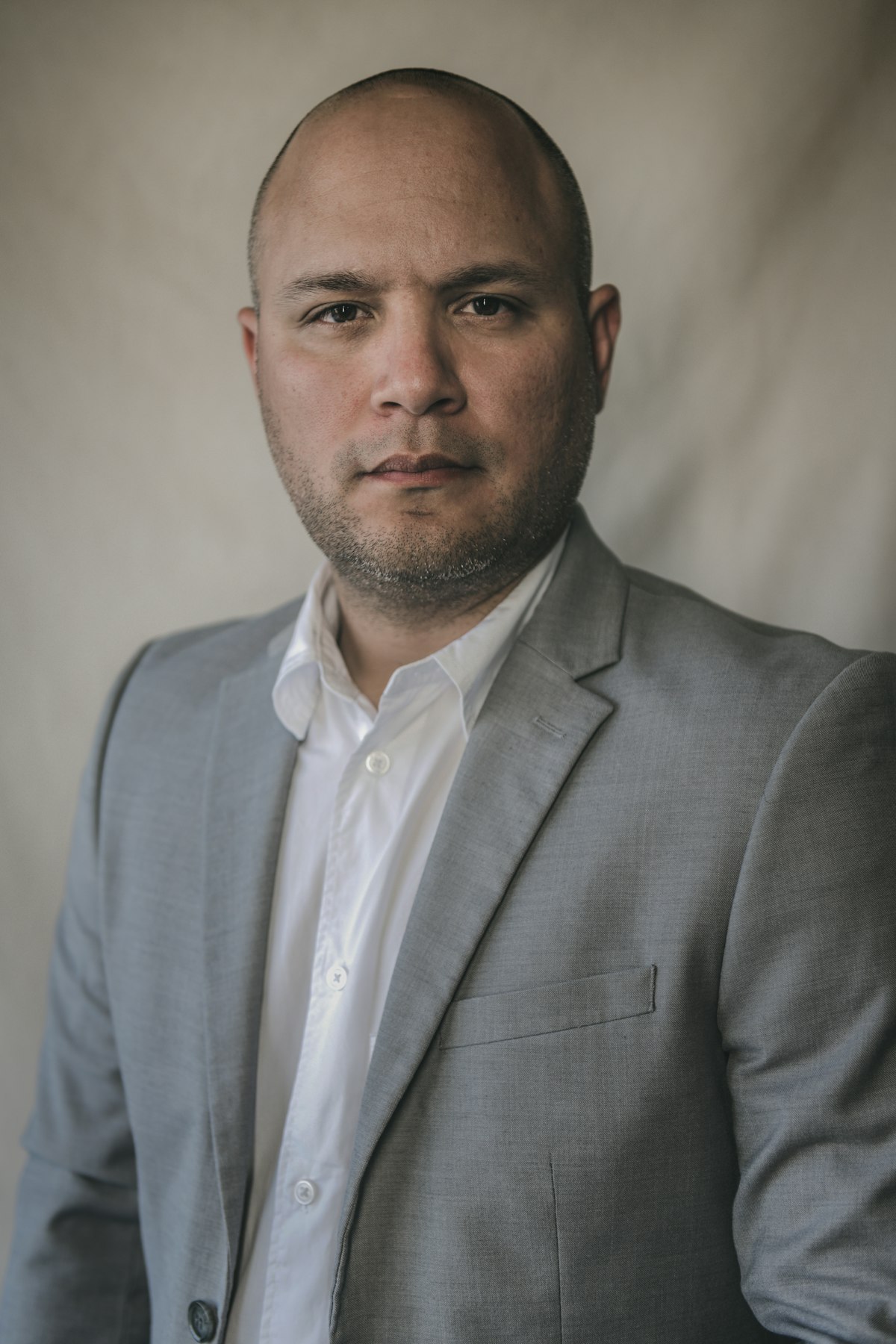 Mid-career Peruvian professional in an office setting